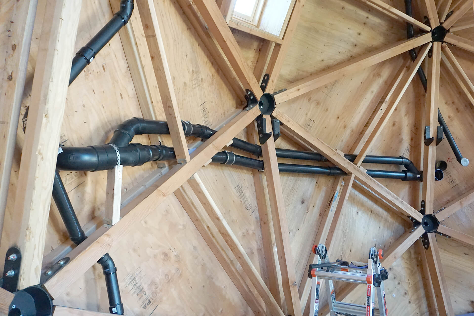 In-wall vents and ducting pipes as viewed from inside the dome.