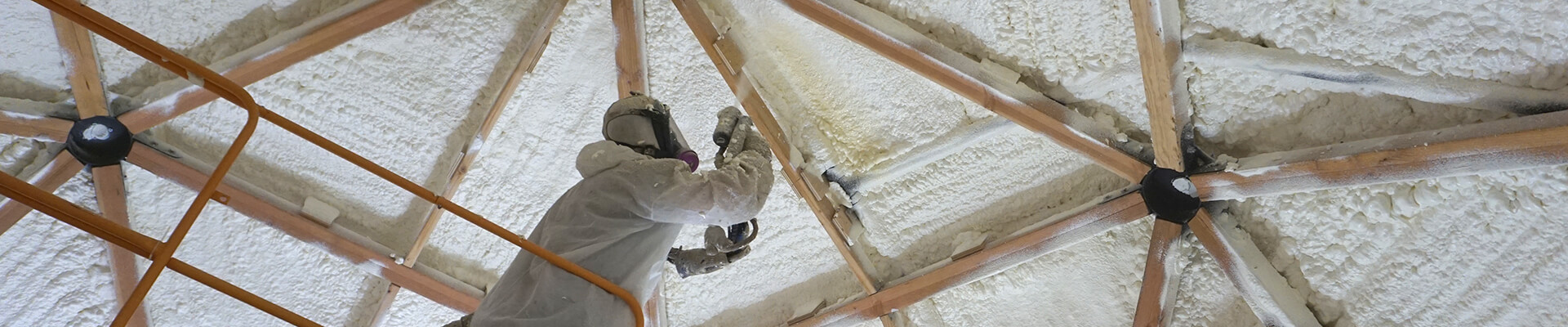 A close-up view of the spray polyurethane foam being applied in the Mini Dome.